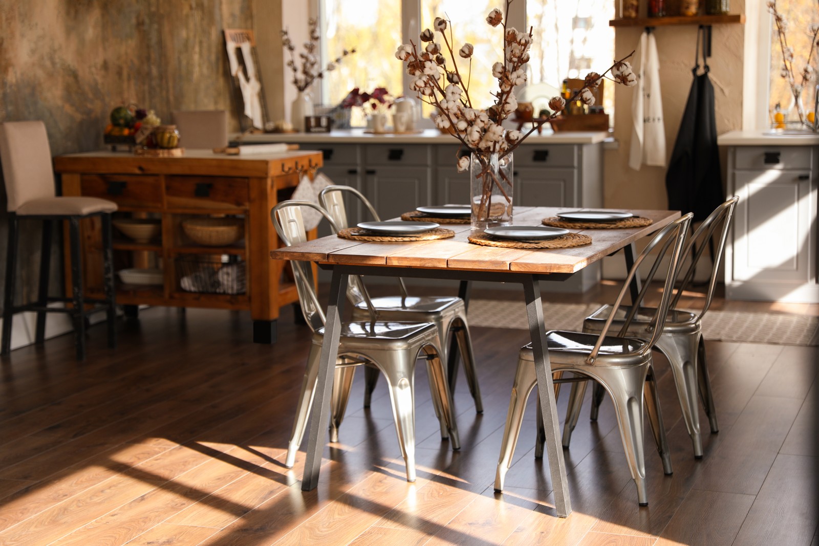 Photo of stylish kitchen interior with dining table and chairs