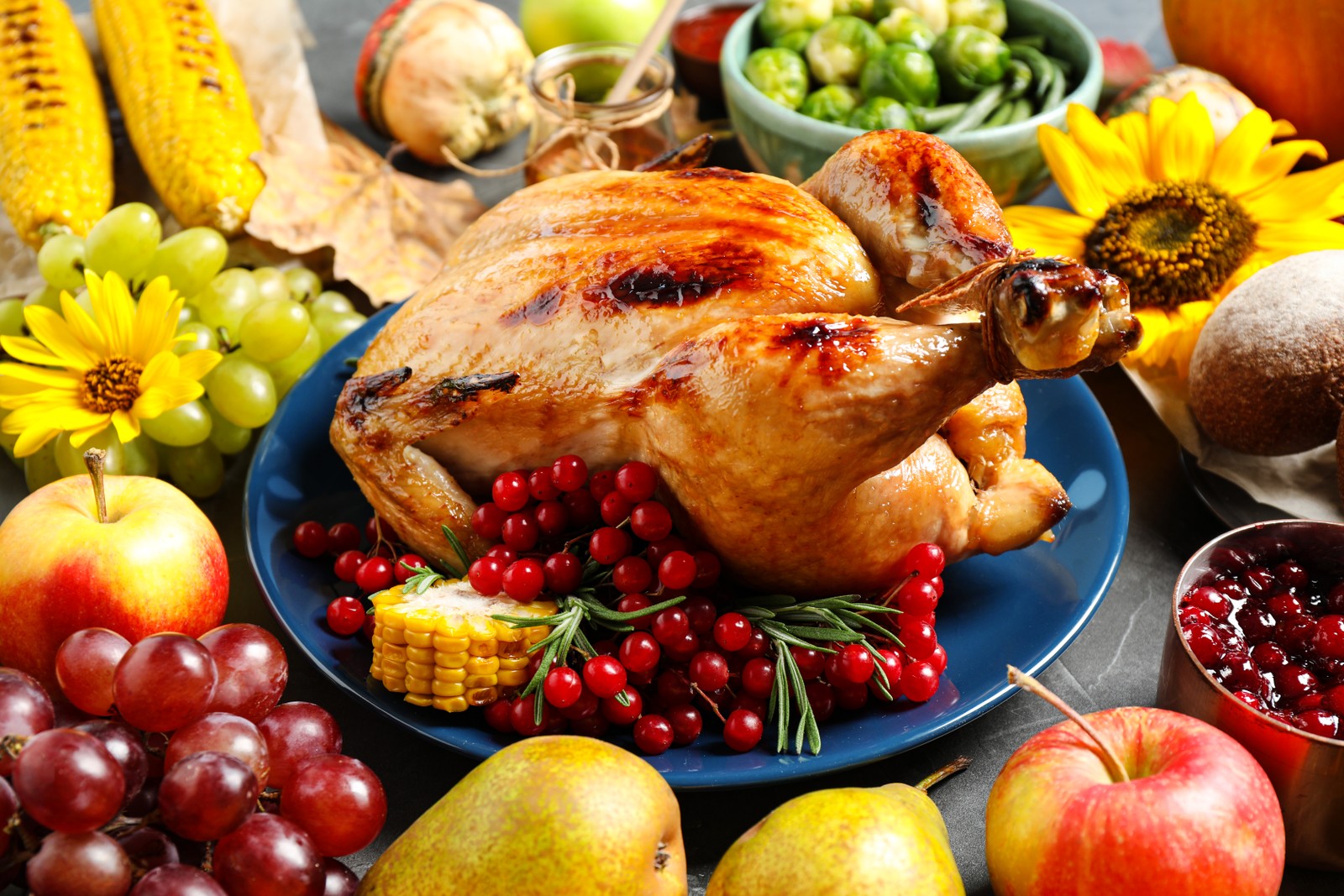 Photos of composition with delicious turkey on grey background. Happy Thanksgiving day