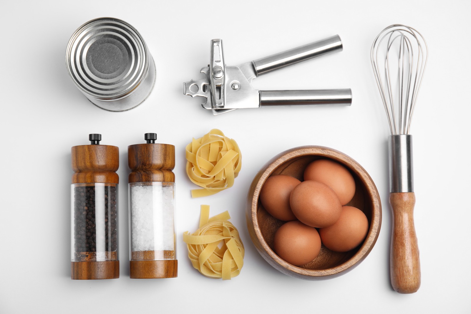 Free photo of cooking utensils and ingredients on white background, top view