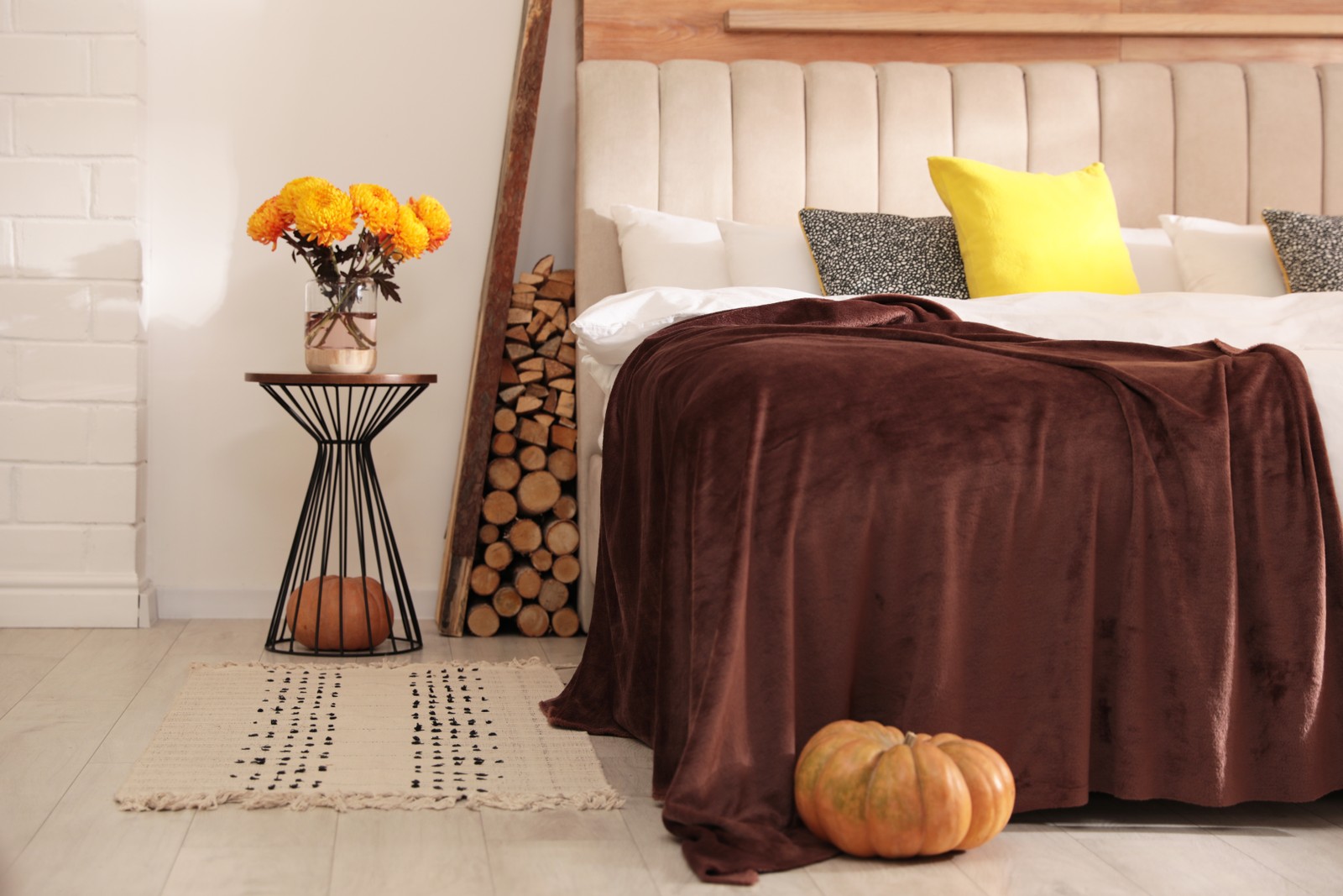 Photo of cozy bedroom interior inspired by autumn color scheme
