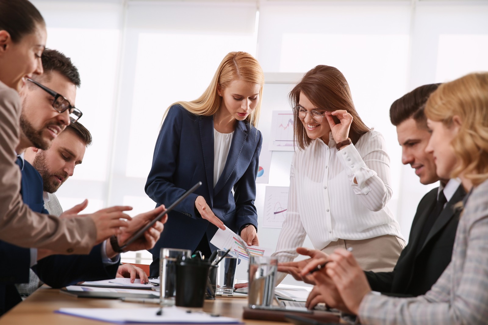 Photo of businesspeople having meeting in office. Management consulting