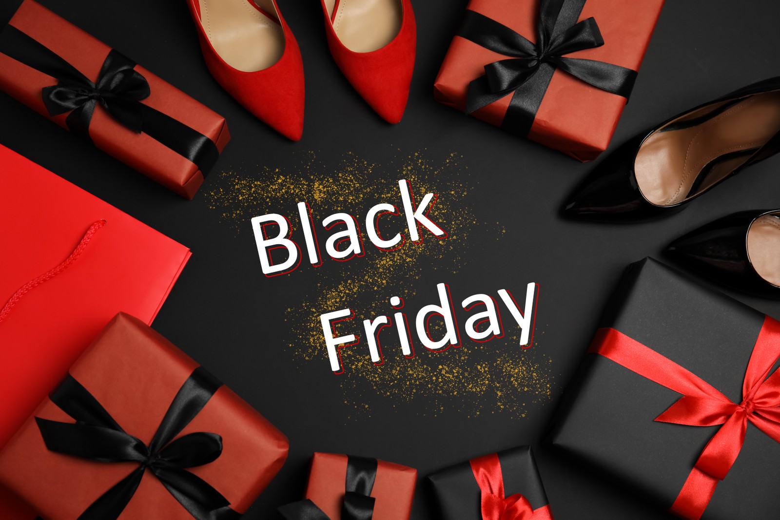 Photo of flat lay composition with stylish women's shoes, gift boxes and phrase Black Friday on dark background