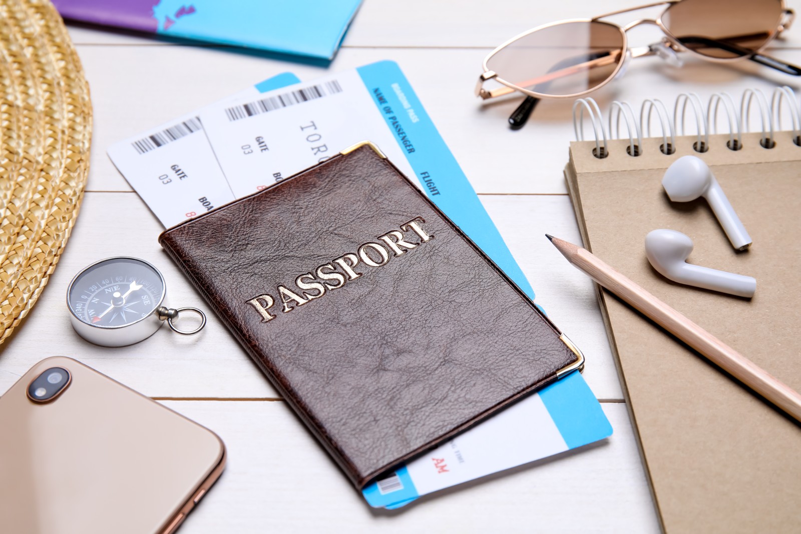Photo of composition with passport and tickets on white wooden table, closeup