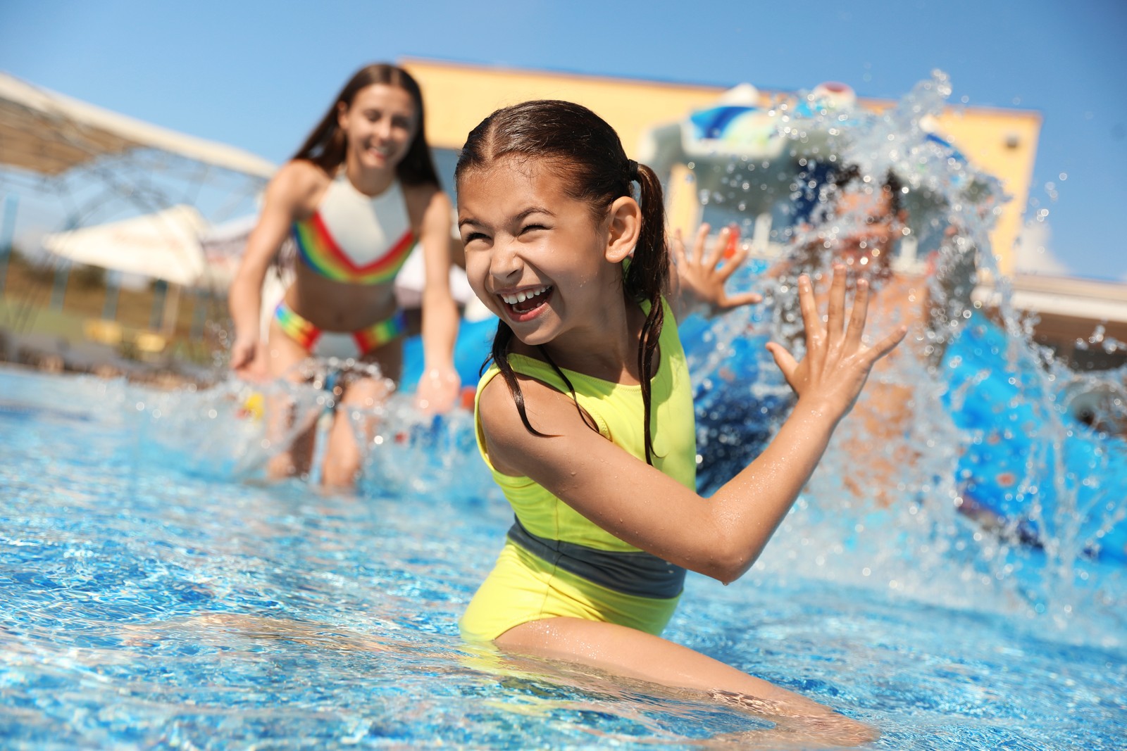 Photo of happy family having fun at water park. Summer vacation