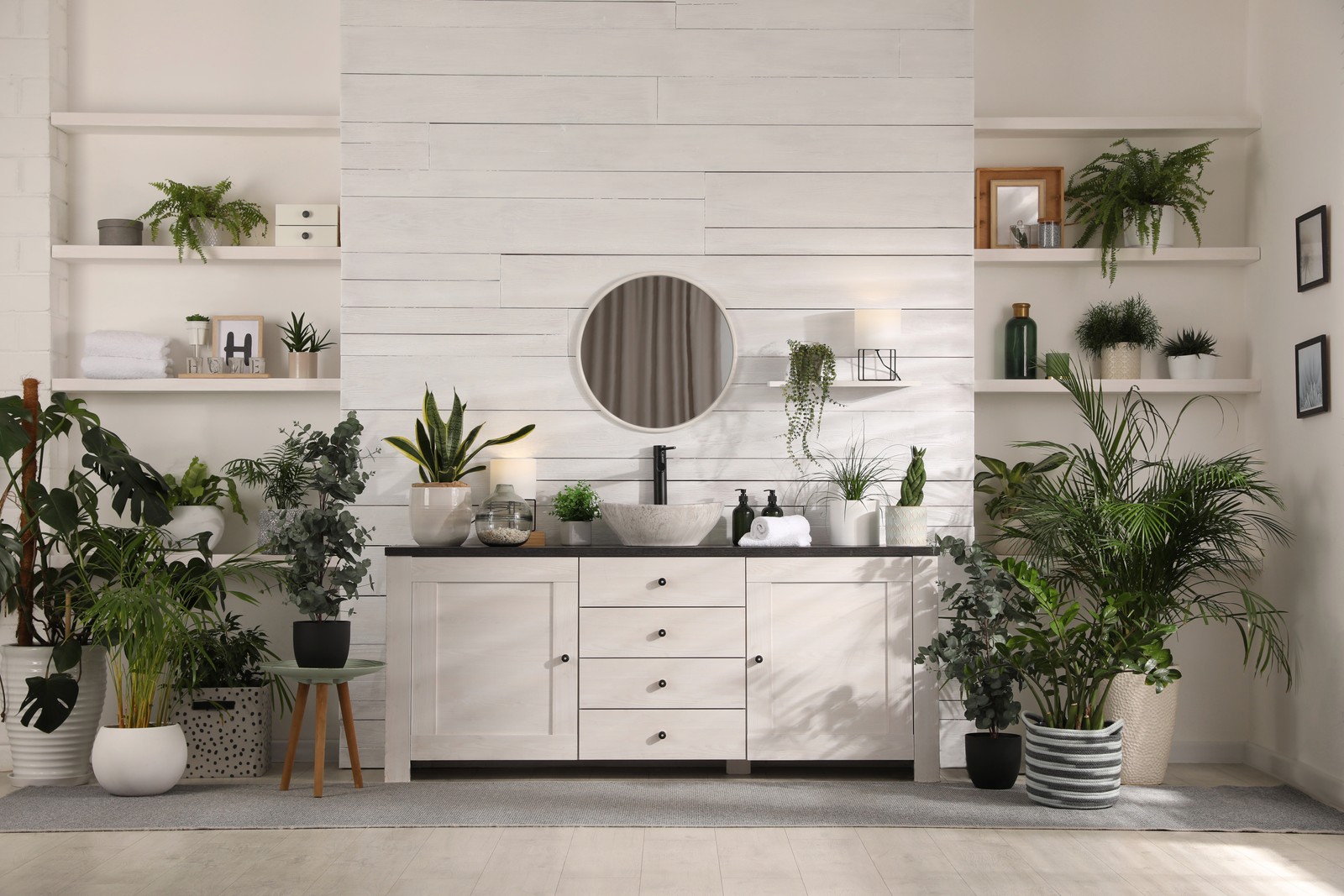 Photo of stylish bathroom interior with vessel sink and beautiful plants