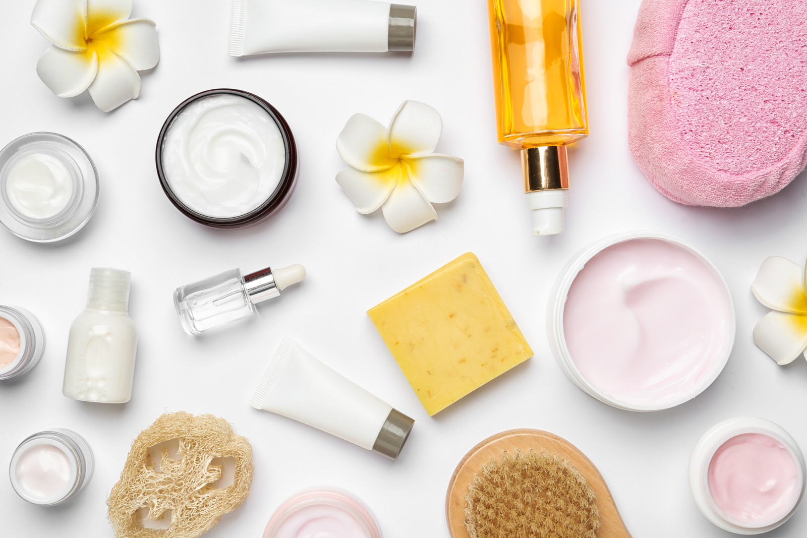 Photo of flat lay composition with body care products on white background