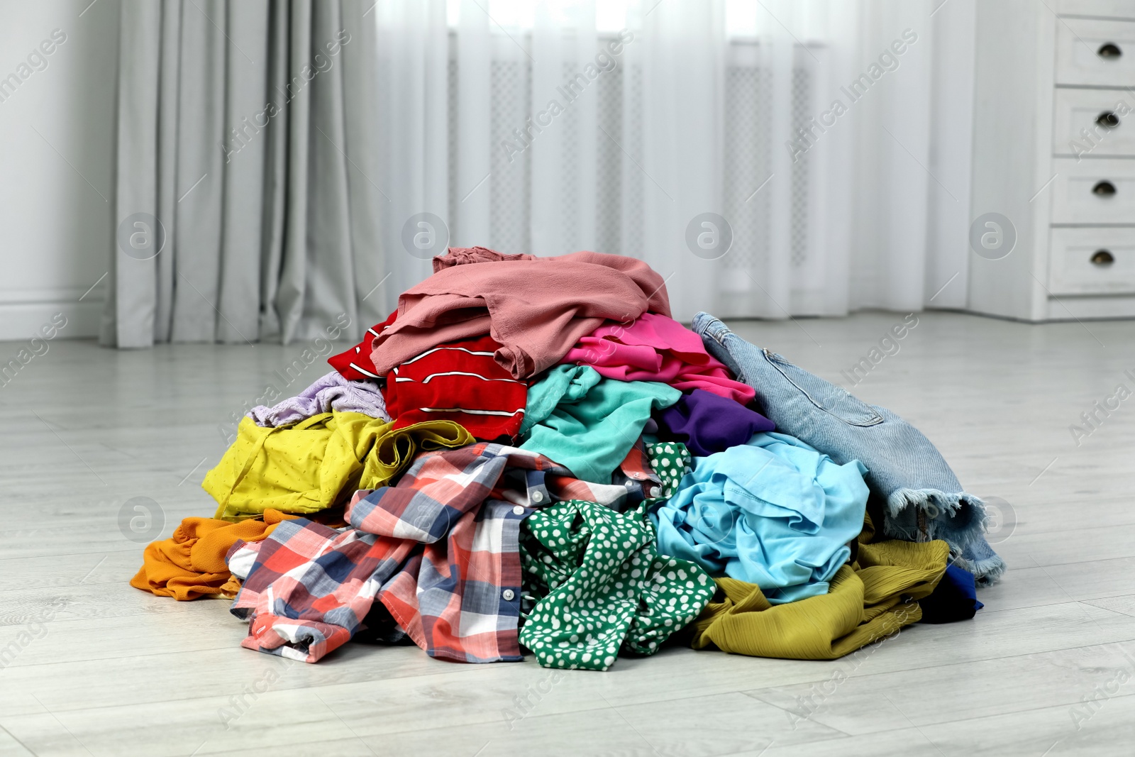 pile-of-dirty-clothes-on-floor-indoors-stock-photo-download-on