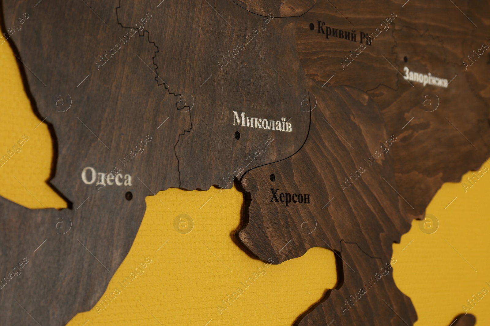 wooden-map-of-southern-ukraine-with-city-names-in-ukrainian-on-yellow